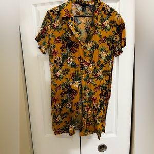 Large button up summer dress. I’m 5’9 and it goes down to mid thigh